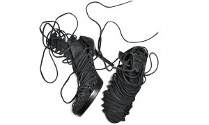 A pair of boots with long laces